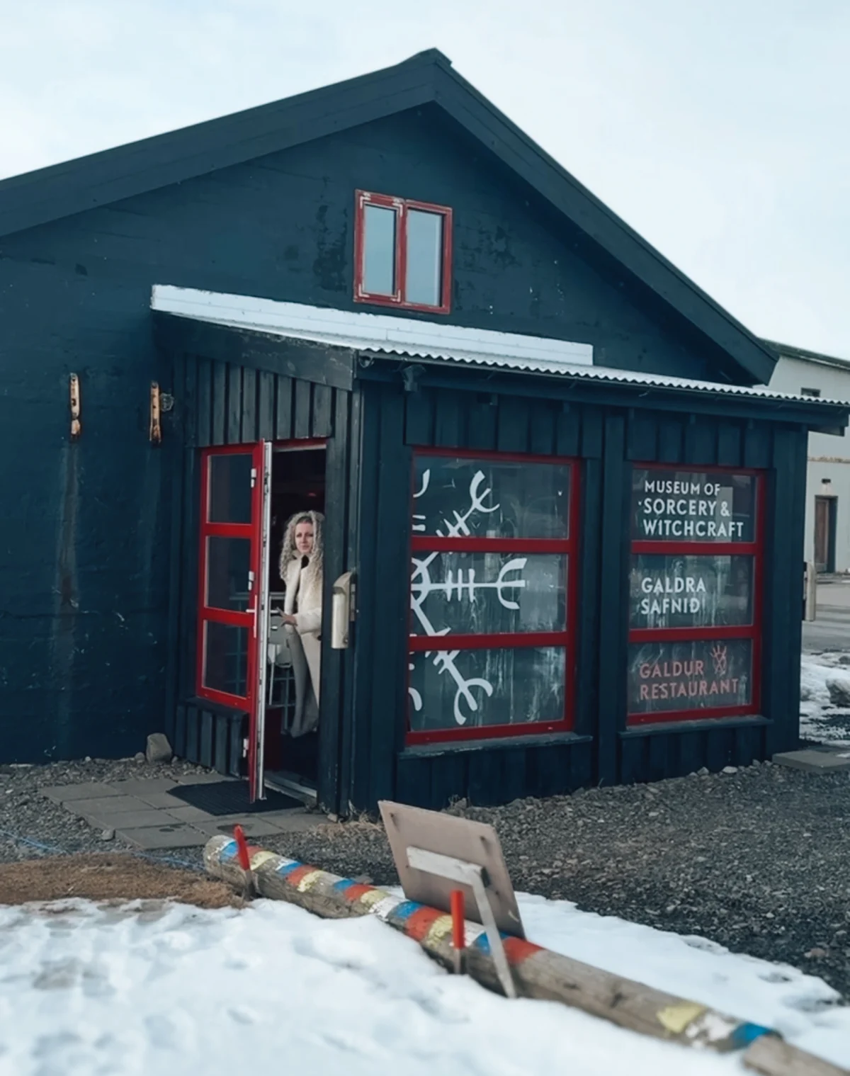 Woman in front of Museum of Sorcery and Witchcraft in Iceland