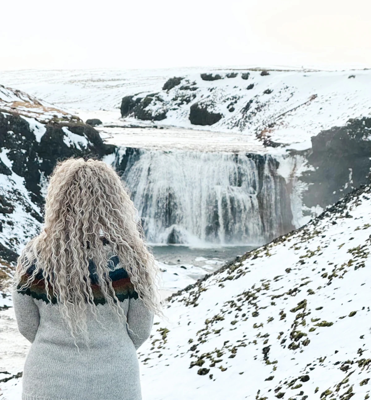 Woman looking at Thorufoss Waterfall in Iceland